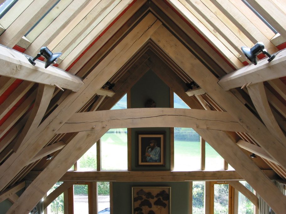 Sweeping oak roof timbers reinforce the structure. Sweeping oak roof timbers reinforce the structure.