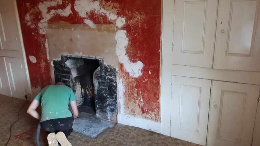 Removal of an old 1920's fireplace revealed a much larger fireplace in behind. Removal of an old 1920's fireplace revealed a much larger fireplace in behind.