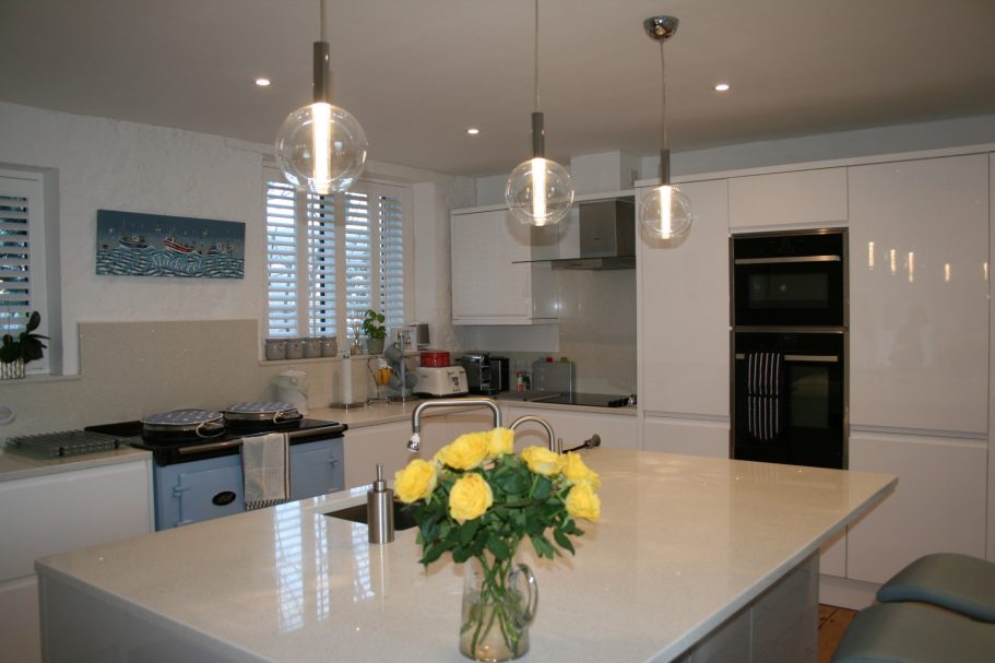 A large and well equipped kitchen with marble work tops and island. A large and well equipped kitchen with marble work tops.