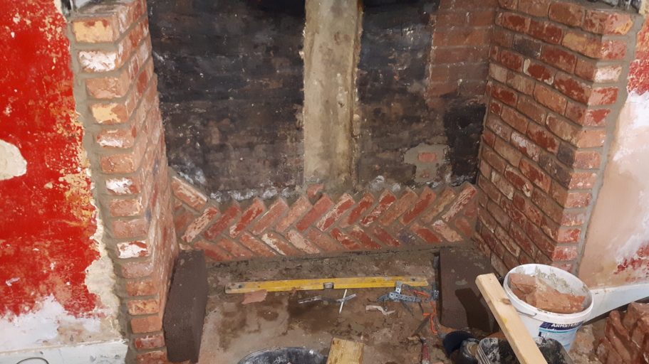 Brick slips were used to create an impressive fireplace. Brick slips were used to create an impressive fireplace.