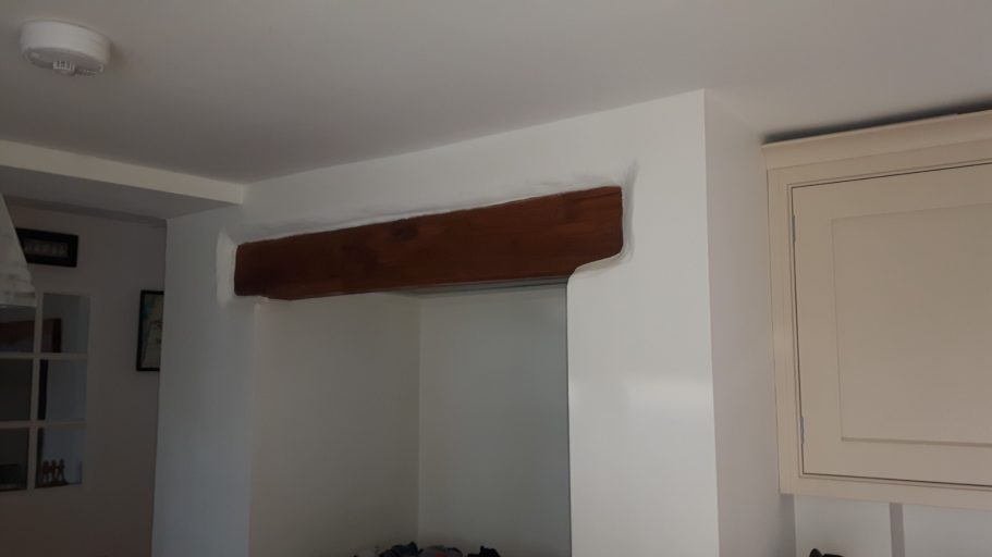 A smaller oak beam above the alcove where an oven is to be installed. A smaller oak beam above the alcove where an oven is to be installed.