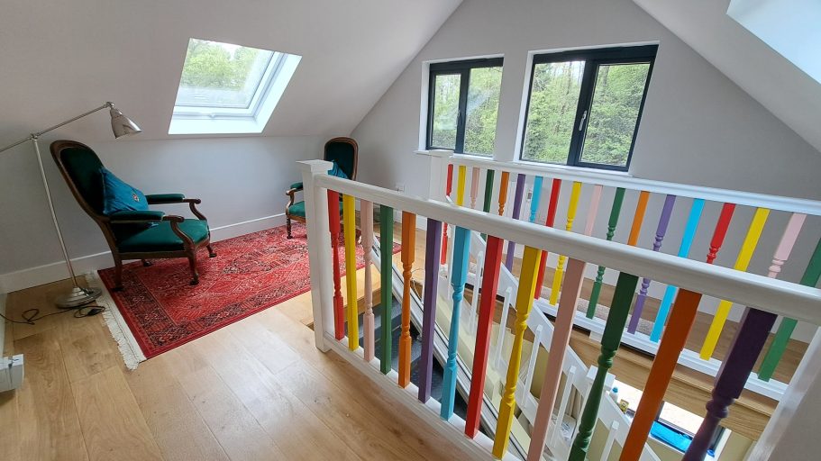 Refreshing handrail spindles & stair lift. Rainbow staircase handrail spindles with white handrails look very fresh.