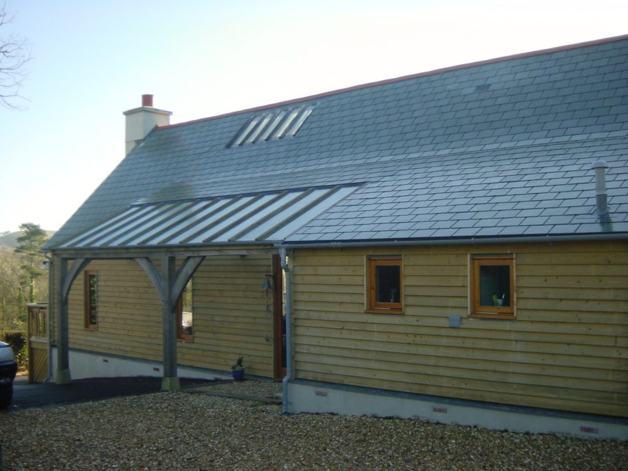 Rear view of green oak timber framed house. Rear view of green oak timber framed house.