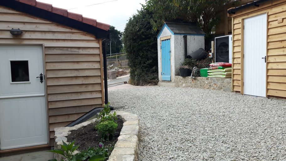 A concrete garage was removed and the driveway landscaped. A concrete garage was removed and the driveway landscaped.