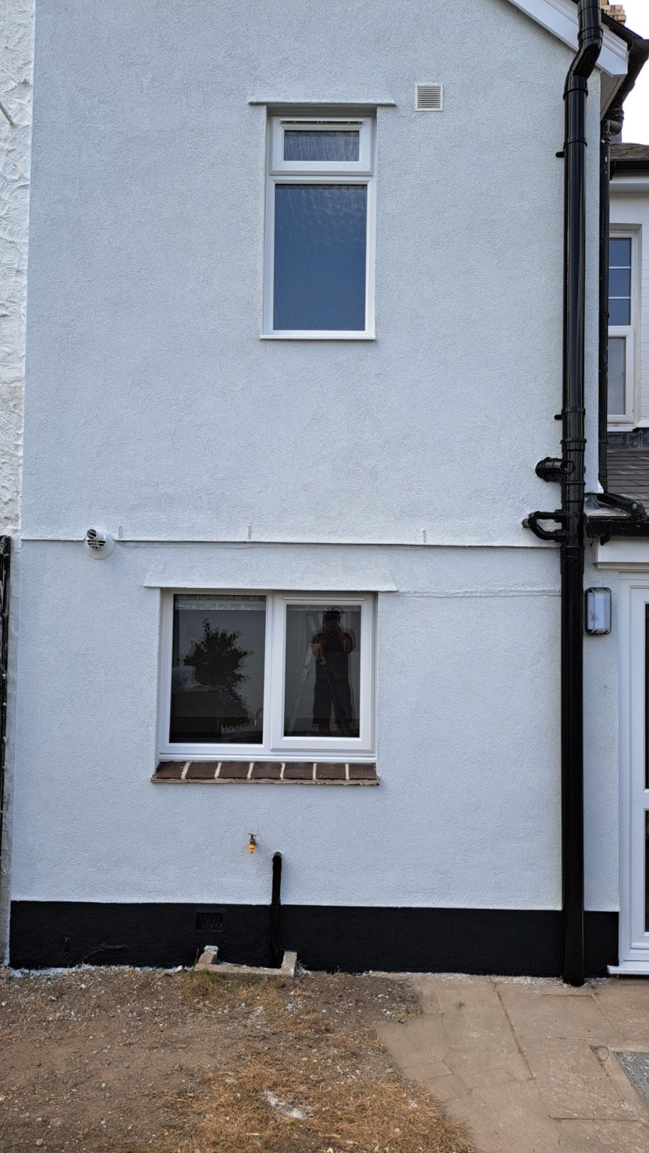 Finished Application of Silicone Hybrid Render to weatherproof wall. Silicone Hybrid Render of gable end of house to weatherproof wall.