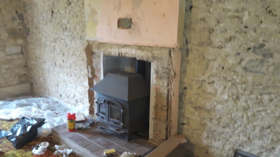 The fireplace in the living room was in a dire state. The fireplace in the living room was in a dire state.