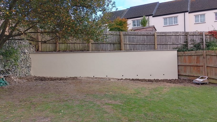 The cap stones are cemented on the top of the wall and the site is cleared. The cap stones are cemented on the top of the wall and the site is cleared.