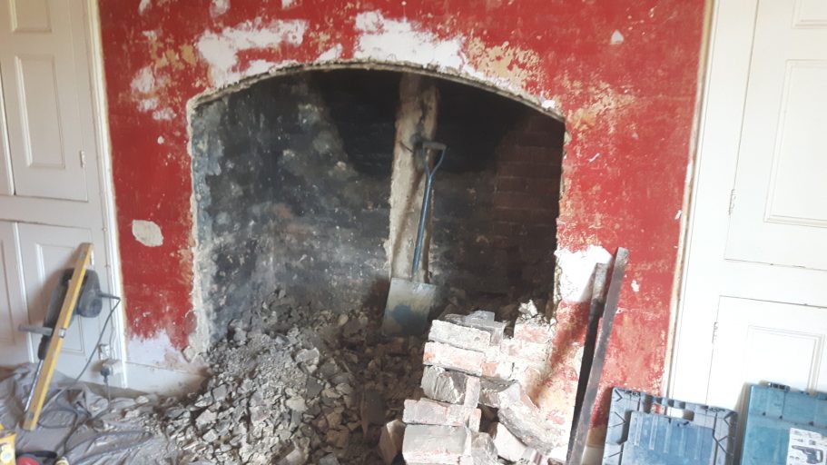 With the 1920's fireplace removed and the rubble removed the size of the fireplace is more apparent. With the 1920's fireplace removed and the rubble removed the size of the fireplace is more apparent.