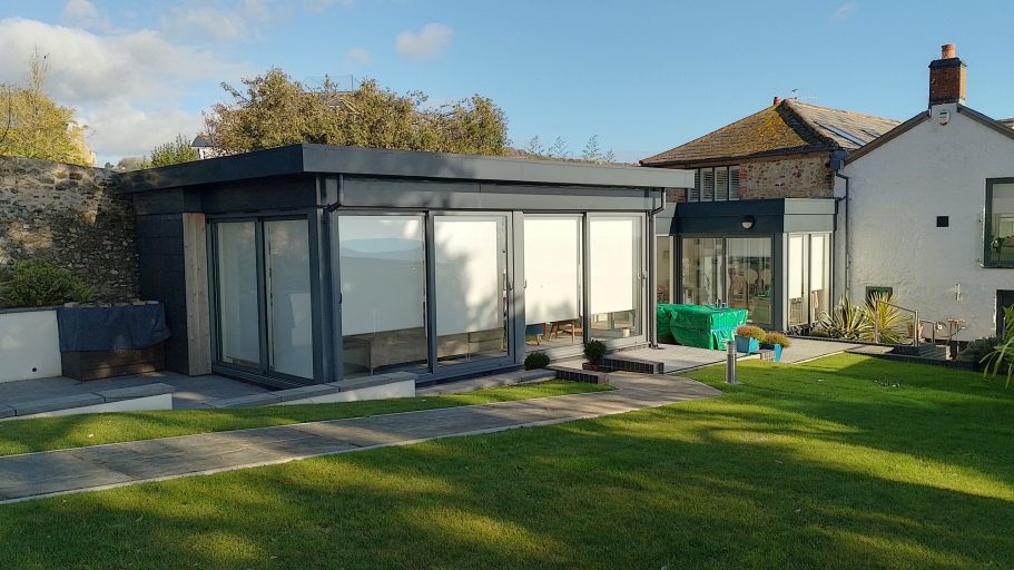 Steel framed extension was finished with powder coated aluminium cladding to give it a clean and easy to maintain finish. Steel framed extension was finished with powder coated aluminium cladding to give it a clean and easy to maintain finish