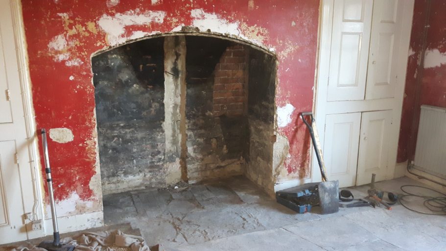 Now fully opened out, the original size of the fireplace is restored. The fireplace was cleared out and cleaned as much as possible to reduce dust.