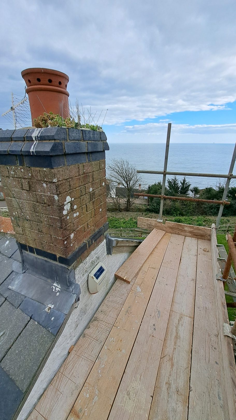 This chimney was leaking water into the property and was not in use, so removal was an option. This chimney was leaking water into the property and was not in use, so removal was an option.