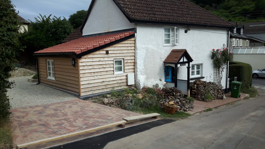 A new piece of tarmac was laid to repair the road surface that had washed out previously. A new piece of tarmac was laid to repair the road surface that had washed out previously.