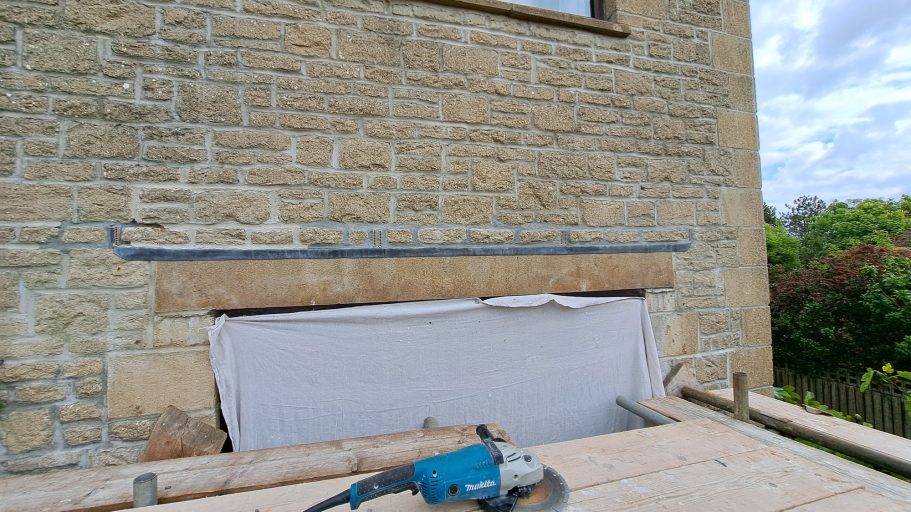 1: Before - Note different colour cement and no lead above patio door. 1: Before - Note different colour cement and no lead above patio door.